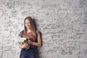 woman holding books 300x201.jpeg